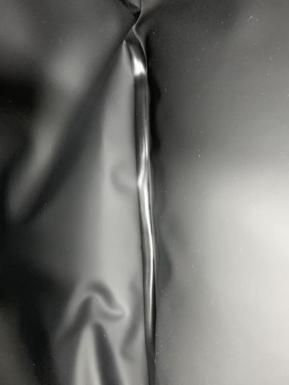Close-up of a high-frequency welded seam on a black soft cooler